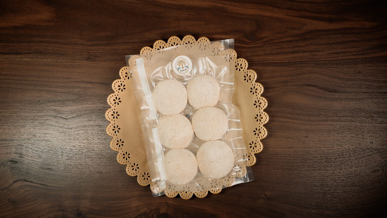 A sealed pack of Asliya Foods kubba on a walnut table